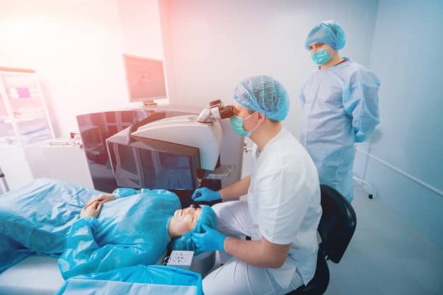 Laser vision correction patient team surgeons operating room during ophthalmic surgery eyelid speculum lasik treatment 179755 7671